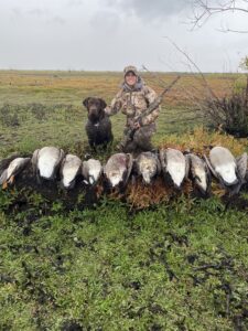 oregon hunter and hunting dog with their ducks