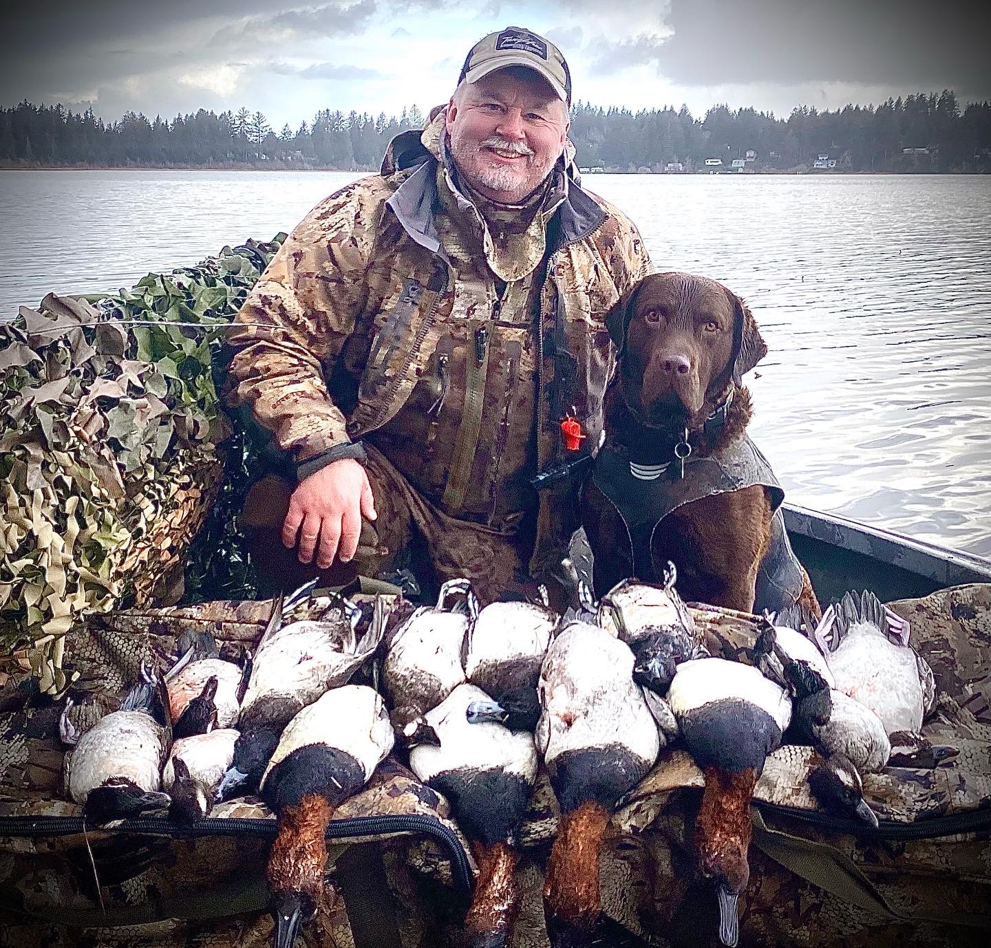 oregon hunter and hunting dog with waterfowls